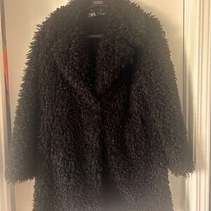 Great fun & fuzzy coat. Large fits like a size 10.